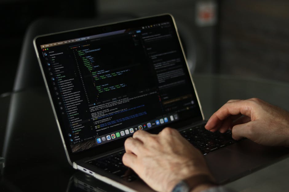 A close-up photograph of a computer screen displaying lines of HTML code. The code features elements such as doctype declaration, html, head, and body tags, with meta tags specifying character encodin